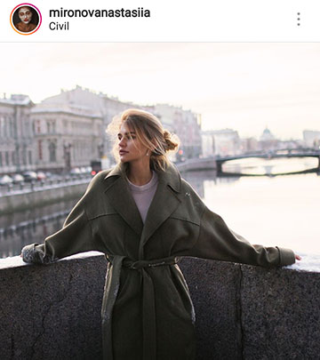 Idei foto de toamnă pentru instagram - o fată pe un pod într-o haină